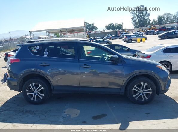 JTMBFREV6GD190941 2016 TOYOTA RAV4 Gray Вид задньої частини салону