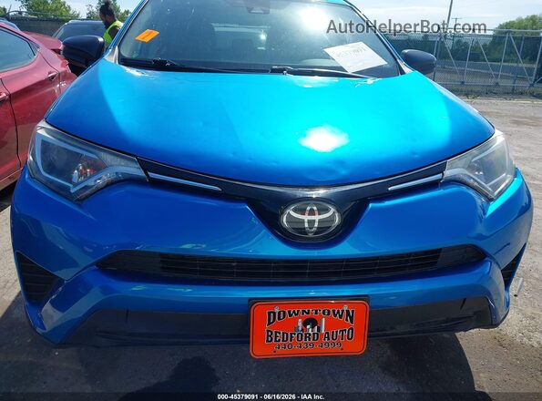 JTMBFREV6JJ734220 2018 TOYOTA RAV4 Blue Instrument cluster view