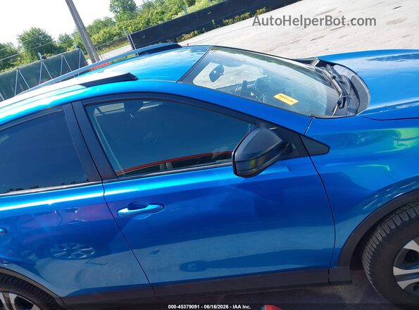 JTMBFREV6JJ734220 2018 TOYOTA RAV4 Blue Rear interior view