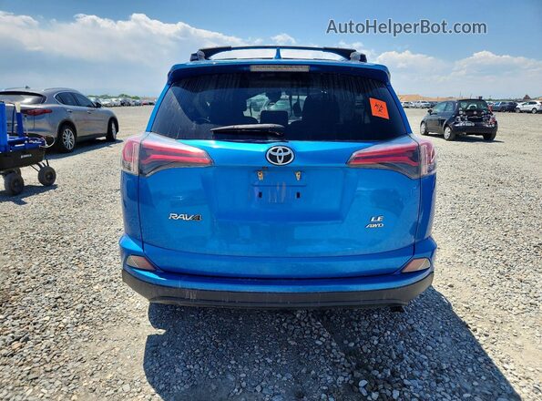 JTMBFREV8HJ706641 2017 TOYOTA RAV4 Blue Rear view
