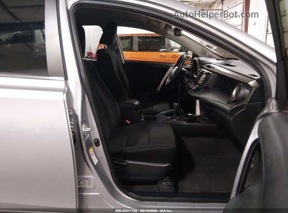 JTMBFREV8JD242383 2018 TOYOTA RAV4 Gray Vista interior delantera