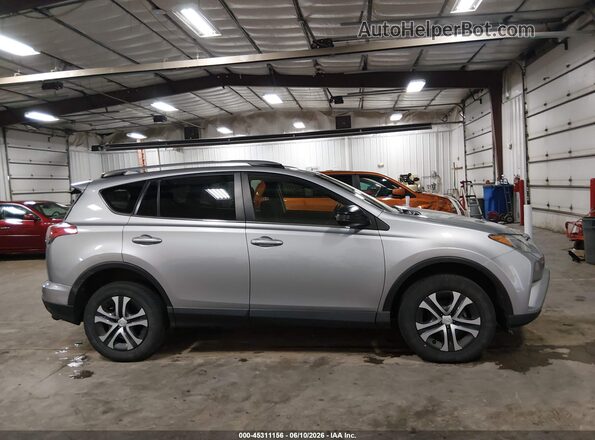 JTMBFREV8JD242383 2018 TOYOTA RAV4 Gray Vista interior trasera