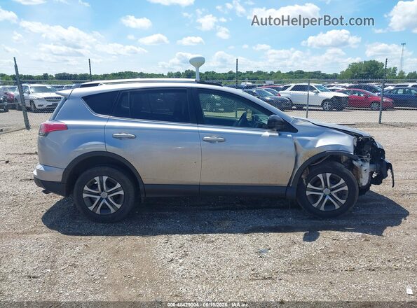 JTMBFREV8JJ194336 2018 TOYOTA RAV4 Silver Widok wnętrza z tyłu