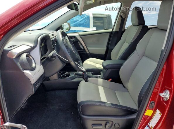 JTMDFREV0JD242094 2018 TOYOTA RAV4 Red Front interior view