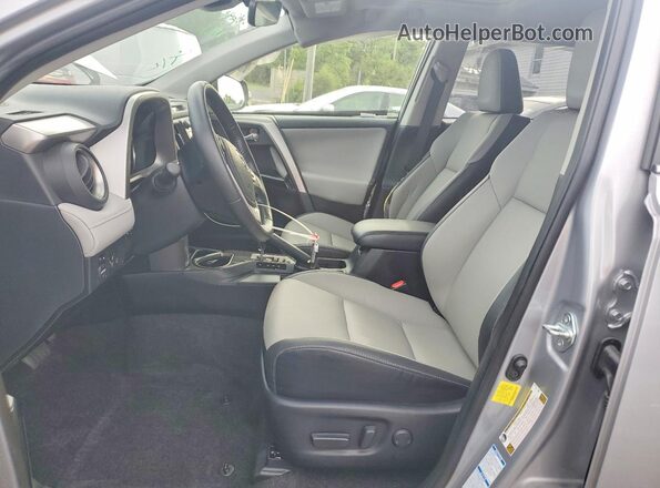 JTMDFREV1JD239463 2018 TOYOTA RAV4 Gray Front interior view