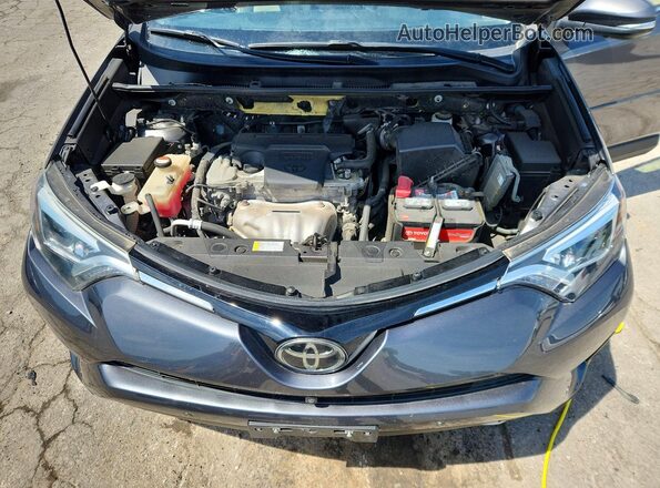 JTMDFREV3GJ077359 2016 TOYOTA RAV4 Charcoal Vista del compartimento del motor