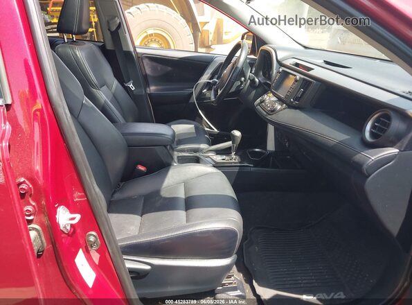JTMDFREV6JD243525 2018 TOYOTA RAV4 Red Front interior view