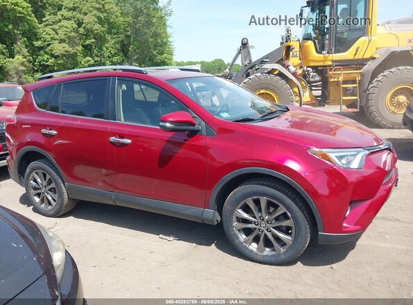 JTMDFREV6JD243525 2018 TOYOTA RAV4 Red Rear interior view