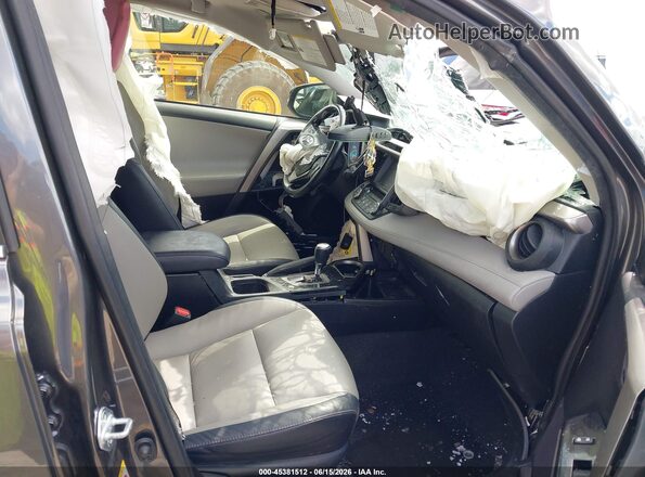 JTMDFREV8JD258155 2018 TOYOTA RAV4 Gray Vista interior delantera