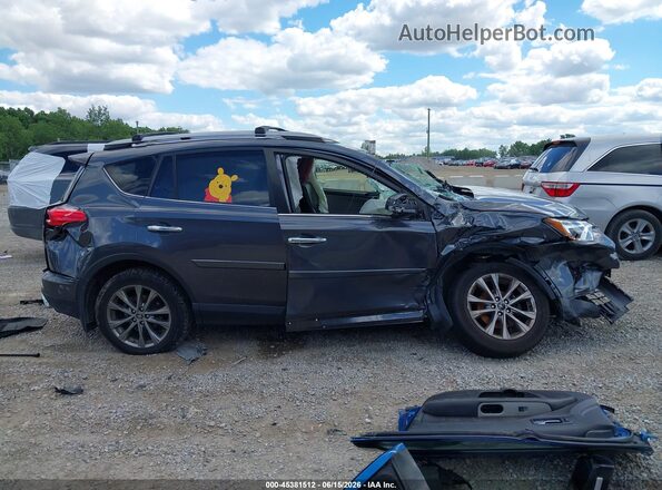 JTMDFREV8JD258155 2018 TOYOTA RAV4 Gray Vista interior trasera