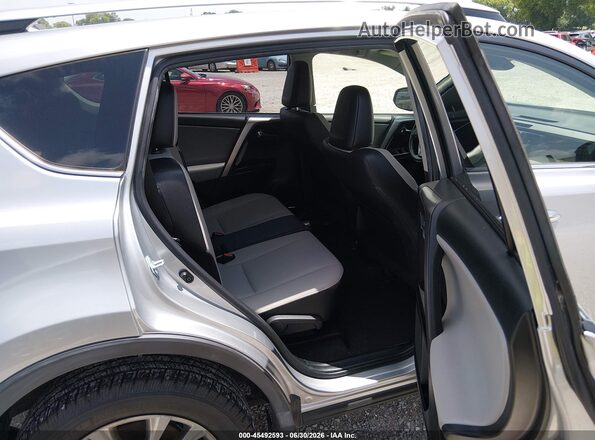 JTMDFREV9JJ259297 2018 TOYOTA RAV4 Gray VIN կոդի պիտակի տեսք