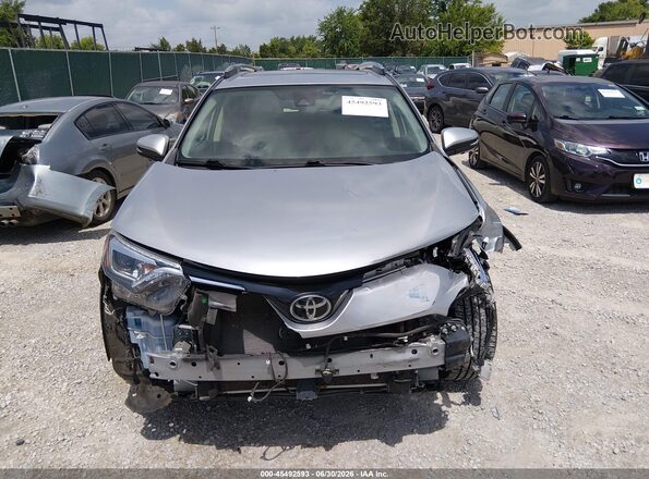 JTMDFREV9JJ259297 2018 TOYOTA RAV4 Gray Սալոնի հետևի տեսք