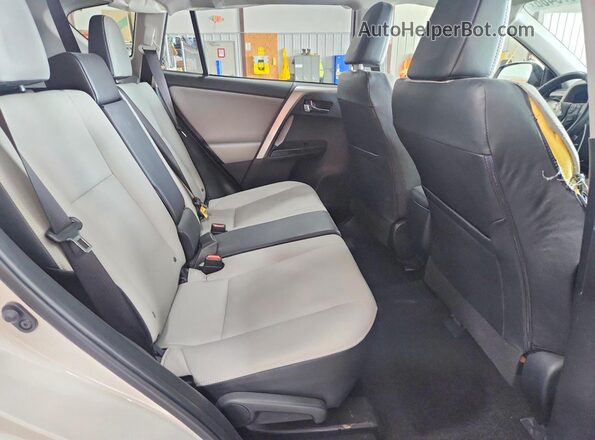 JTMDFREVXJJ731040 2018 TOYOTA RAV4 White Rear seats view
