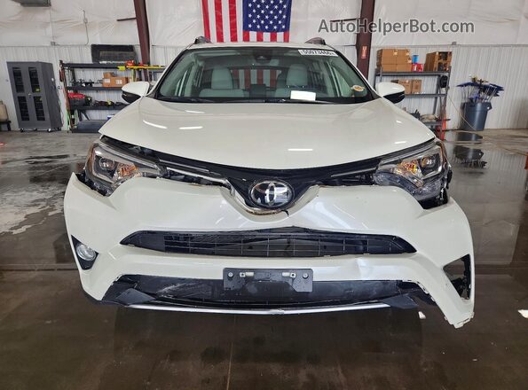 JTMDFREVXJJ731040 2018 TOYOTA RAV4 White Front view