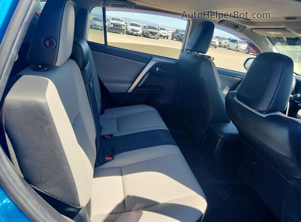 JTMDJREV2HD142152 2017 TOYOTA RAV4 Blue Rear seats view