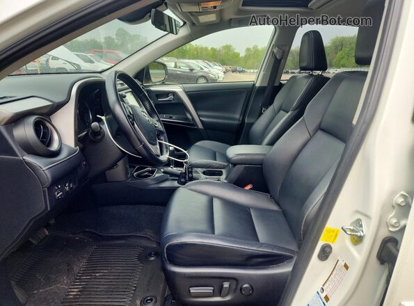 JTMDJREV4GD004479 2016 TOYOTA RAV4 White Front interior view