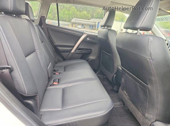 JTMDJREV4GD004479 2016 TOYOTA RAV4 White Rear interior view