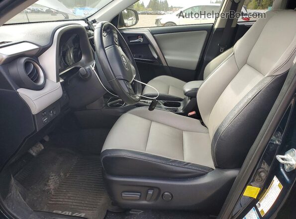 JTMDJREV4JD195439 2018 TOYOTA RAV4 Blue Vista interior delantera