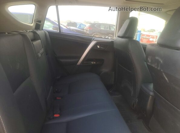 JTMDJREV9GD042483 2016 TOYOTA RAV4 White Rear interior view