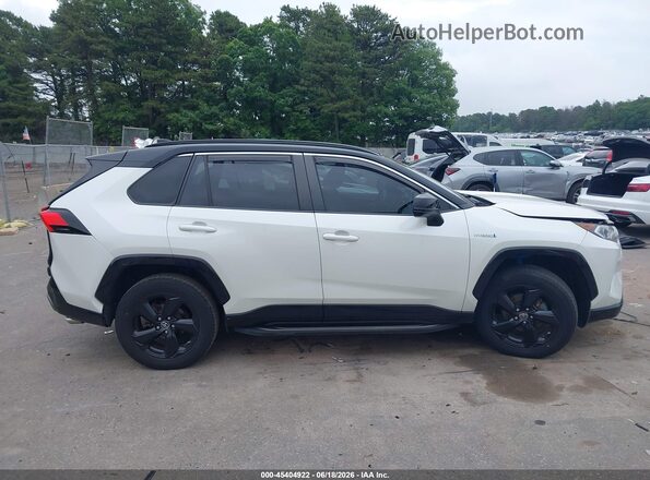 JTMEWRFVXKJ014089 2019 TOYOTA RAV4 HYBRID Белый Вид задней части салона
