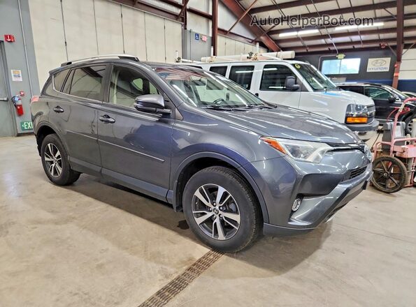 JTMRFREV1GD190344 2016 TOYOTA RAV4 Gray Front right
