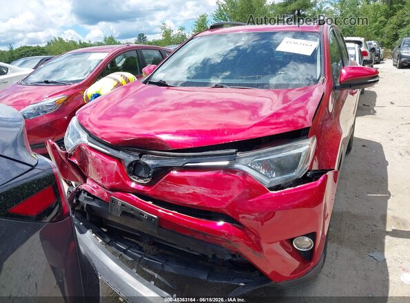 JTMRFREV1HJ112987 2017 TOYOTA RAV4 Red Rear interior view