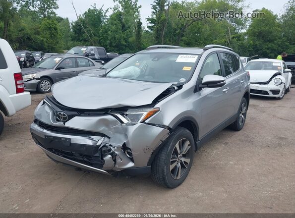JTMRFREV4JJ216749 2018 TOYOTA RAV4 Серебряный Передняя левая четверть