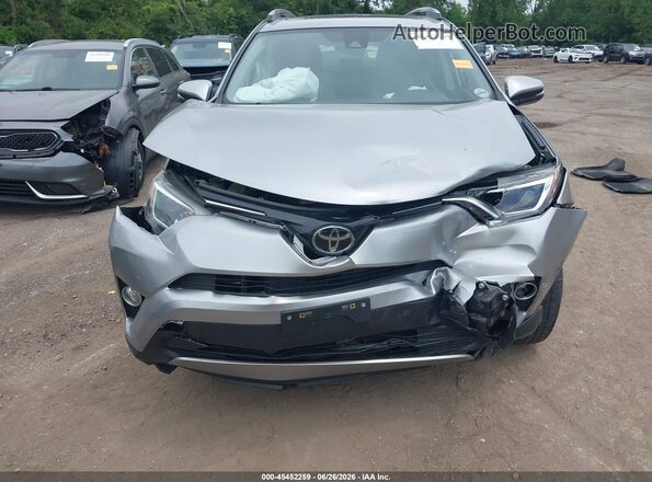 JTMRFREV4JJ216749 2018 TOYOTA RAV4 Серебряный Вид спереди