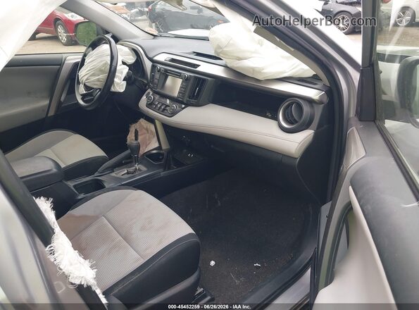JTMRFREV4JJ216749 2018 TOYOTA RAV4 Серебряный Вид салона спереди