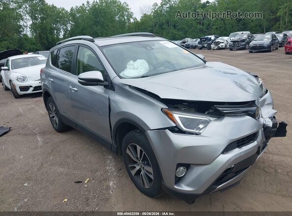 JTMRFREV4JJ216749 2018 TOYOTA RAV4 Серебряный Вид задней части салона