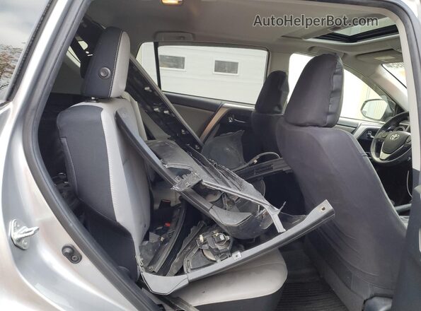 JTMRFREV4JJ228755 2018 TOYOTA RAV4 Silver Rear interior view