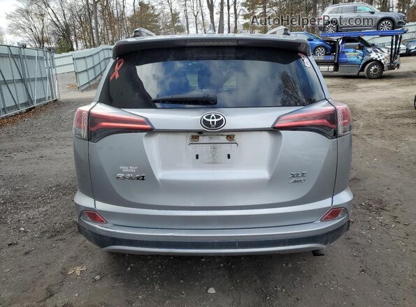 JTMRFREV4JJ228755 2018 TOYOTA RAV4 Silver Rear view