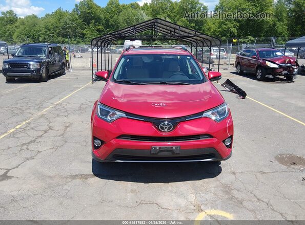 JTMRFREV6HJ145581 2017 TOYOTA RAV4 Red Vista interior trasera