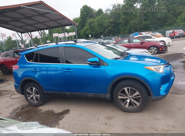 JTMRFREV9GJ076349 2016 TOYOTA RAV4 Light Blue Вид задньої частини салону