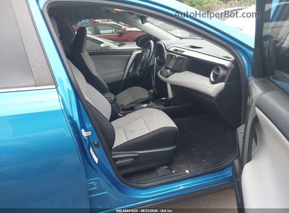 JTMRFREV9GJ076349 2016 TOYOTA RAV4 Light Blue Вид салону спереду