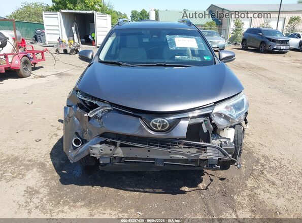 JTMRFREVXJJ725485 2018 TOYOTA RAV4 Gray Vista interior trasera