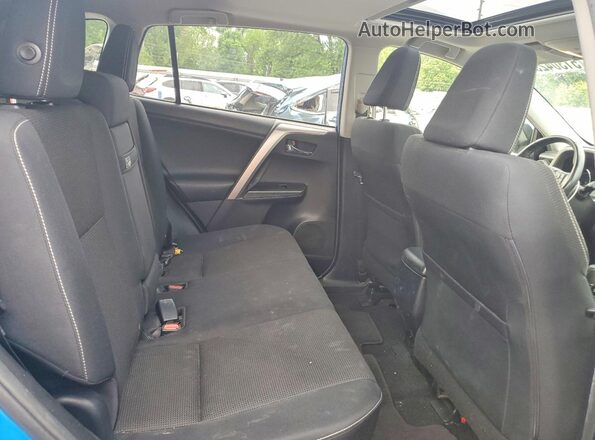 JTMRJREV1GD042032 2016 TOYOTA RAV4 Blue Rear interior view