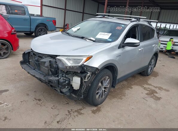 JTMRJREV5GD010927 2016 TOYOTA RAV4 HYBRID Silver Vista tres cuartos delantera izquierda