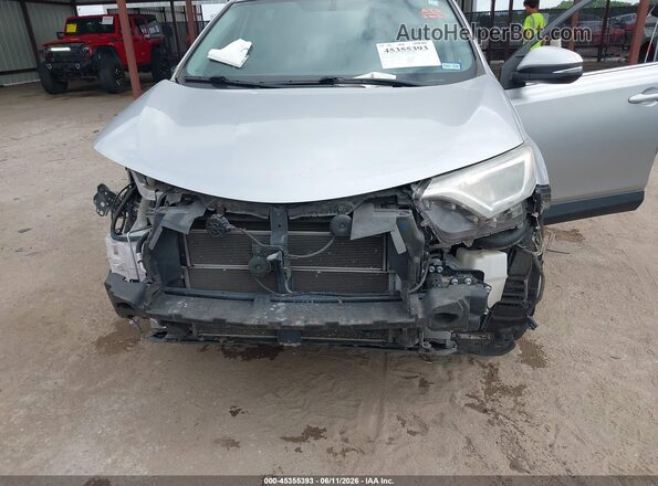 JTMRJREV5GD010927 2016 TOYOTA RAV4 HYBRID Silver Vista interior delantera