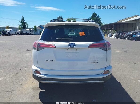 JTMRJREV6GD057609 2016 TOYOTA RAV4 HYBRID White 