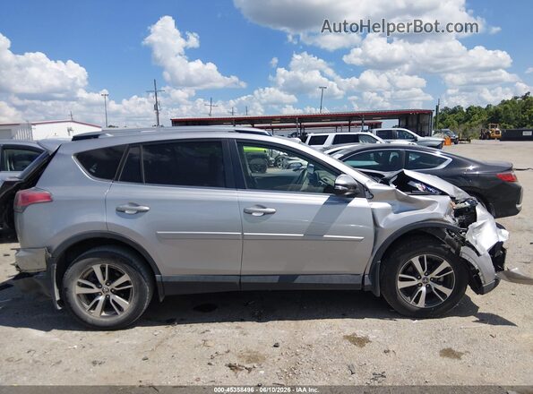 JTMWFREV0JJ160327 2018 TOYOTA RAV4 Silver Вид задньої частини салону