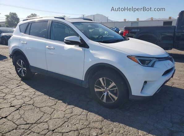 JTMWFREV0JJ197376 2018 TOYOTA RAV4 White Front right