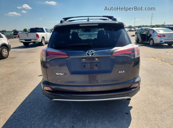 JTMWFREV1JJ736555 2018 TOYOTA RAV4 Gray Rear view