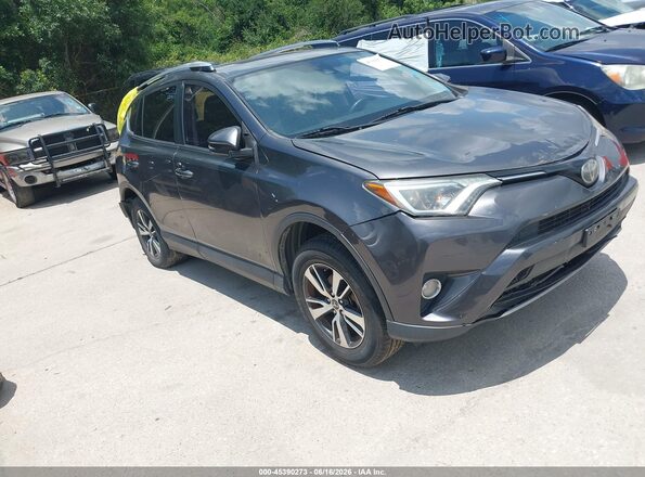 JTMWFREV2JJ740923 2018 TOYOTA RAV4 Gray Vista interior trasera