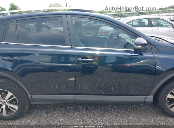 JTMWFREV3JJ165618 2018 TOYOTA RAV4 Blue Rear interior view