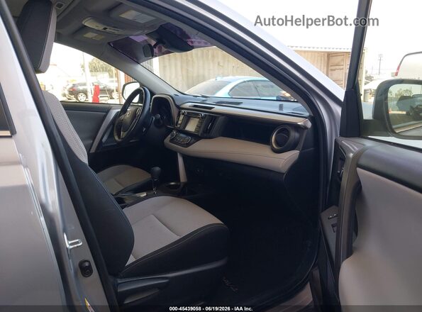JTMWFREV4JD130584 2018 TOYOTA RAV4 Silver Vista interior delantera