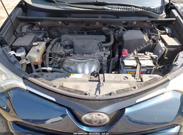 JTMWFREV4JJ172528 2018 TOYOTA RAV4 Blue Rear view