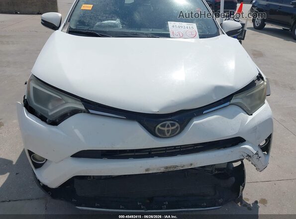 JTMWFREV4JJ728899 2018 TOYOTA RAV4 White Front view