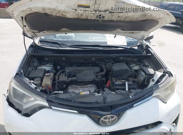 JTMWFREV4JJ728899 2018 TOYOTA RAV4 White Rear view