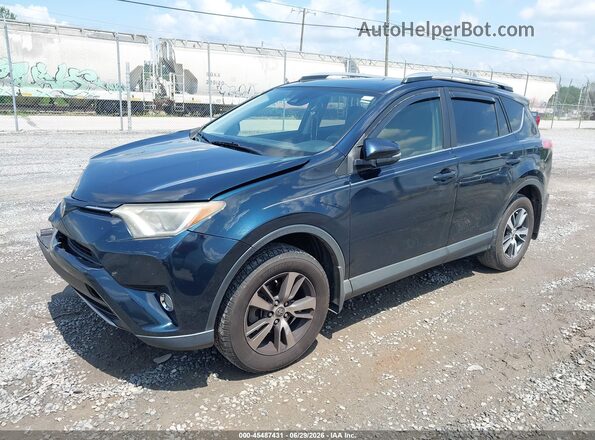 JTMWFREV5HJ142349 2017 TOYOTA RAV4 Dark Blue Vista tres cuartos delantera izquierda